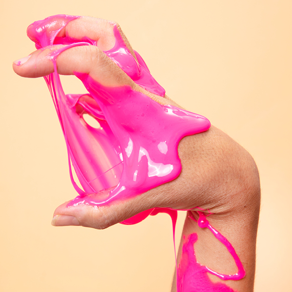 hand with pink slime